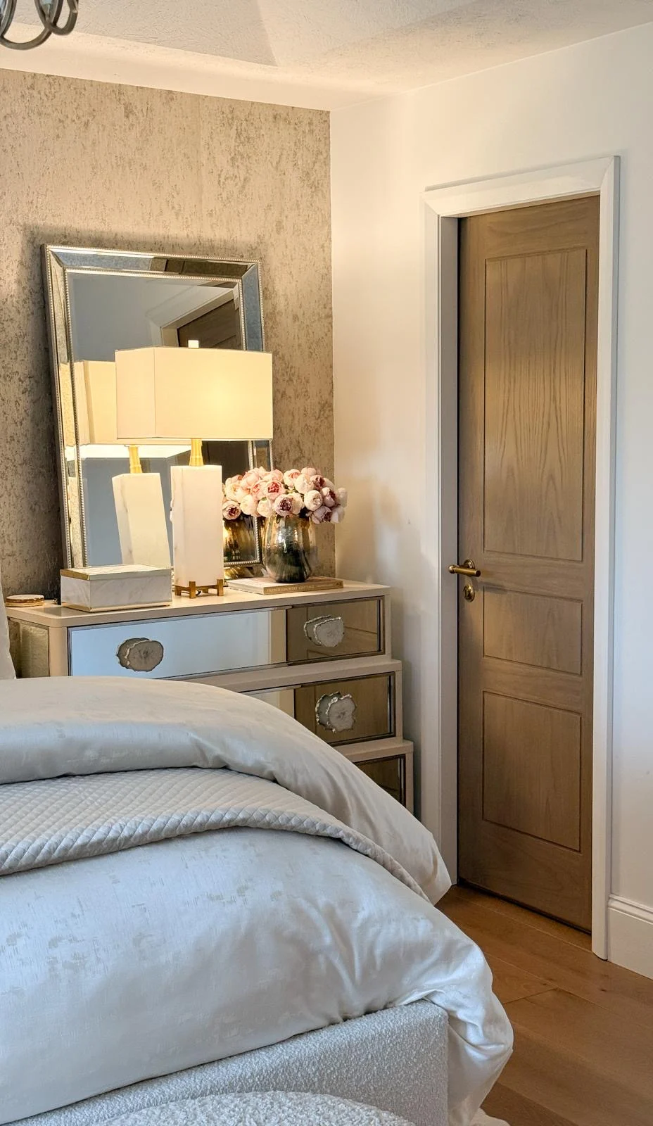 A bedroom door in a soft neutral scheme