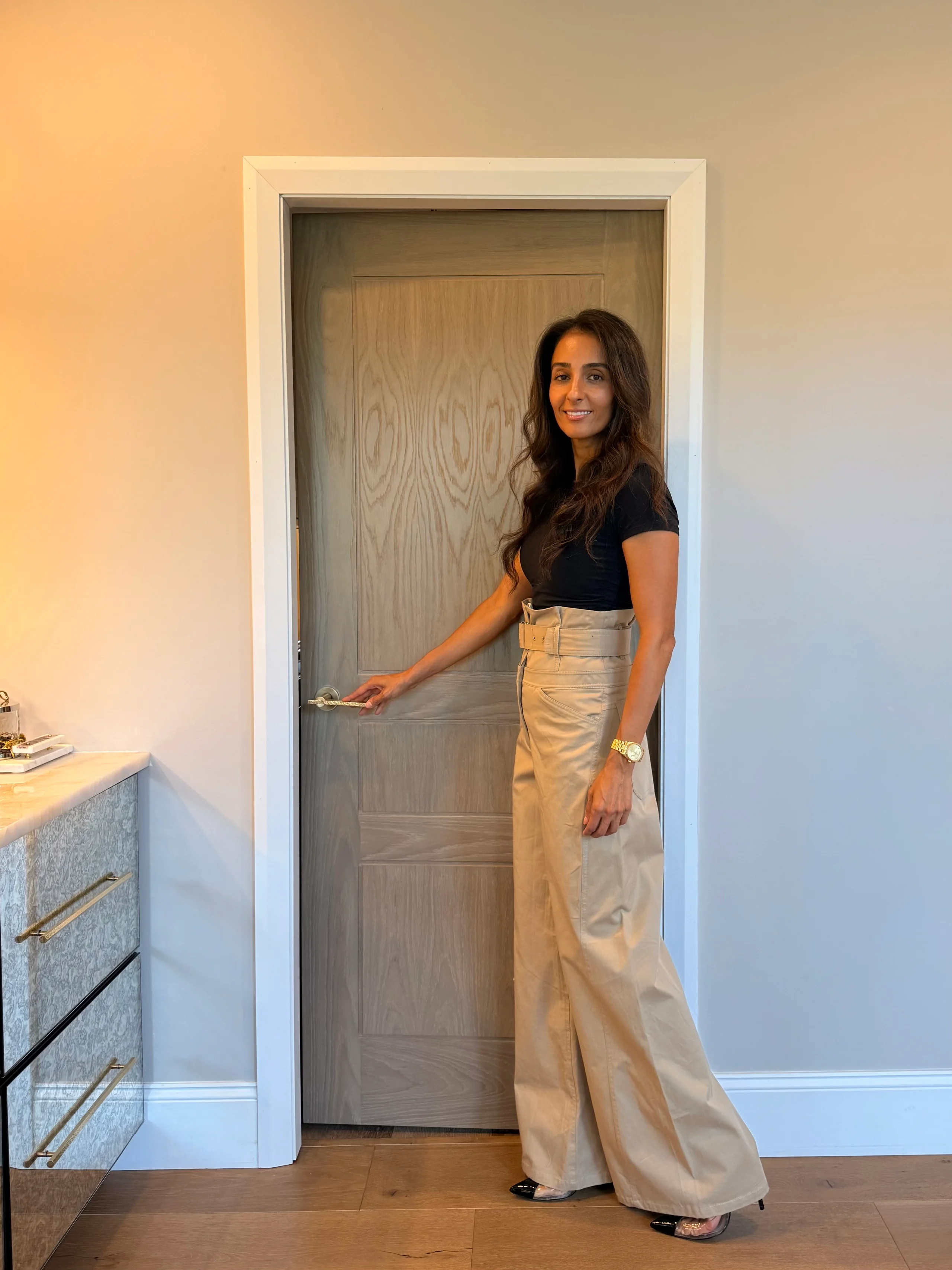 Farah Merhi photographed beside a Detroit Model door